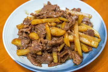 A delicious home-cooked dish, fried beef with potatoes