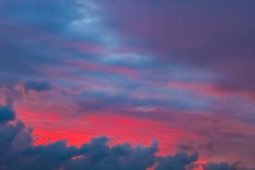 Naklejka na ściany i meble Amazing colorful pink violet blue and purple sunset sky panorama.