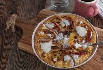 Protein pancake made with eggs and ground oats. Pan fried with fresh apples and topped with yogurt