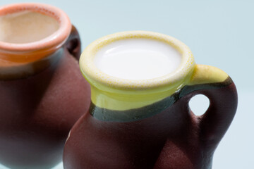 Clay jugs with milk.