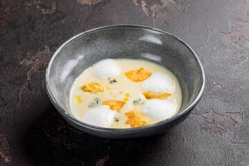 cream cheese soup on dark stone table