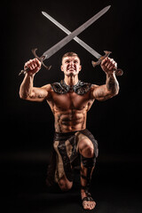 Fototapeta na wymiar Antique warrior with sword against dark background