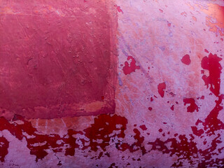 Old grunge red paint texture. Outdoor textured retro messy background.