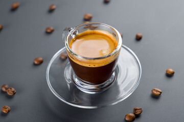 espresso coffee on cup on grey table