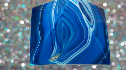 Blue violet pyramid of agate with quartz inclusions or worked as a disc