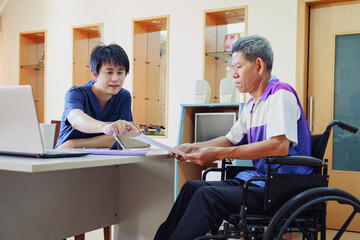 Obraz premium After accident and rehabilitation, a disabled man can return to work again. The company which job hiring employing disable people will receive tax deductions benefits.