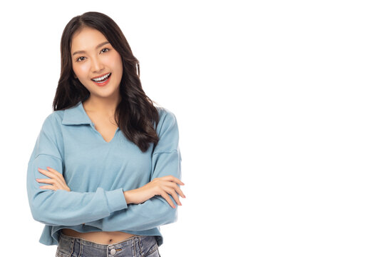 Portrait smiling young asian woman with crossed arms Happy asia girl posing with crossed arms and looking at camera isolated on white background copy space Confident female get happy and feel relax