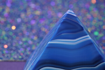 Blue violet pyramid of agate with quartz inclusions or worked as a disc