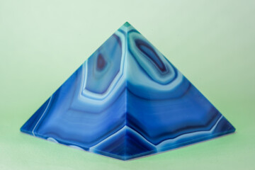 Blue violet pyramid of agate with quartz inclusions or worked as a disc