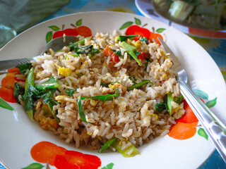 Vintage style Thai traditional local food stir fried rice with egg and vegetable tomato, food background wallpaper