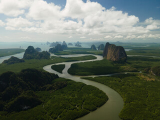 Aerial view of a swerving river through a series of limestones in Phang Nga Bay