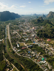 Aerial view of the town of Phang Nga tucked in between limestones
