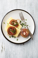 Sandwich with cheese and tomatoes. Bright wooden background. Top view. Copy space. 