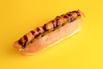 Hot dog with chicken, hot dog on yellow background, bright background