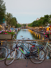Fototapeta na wymiar Sunset in Amsterdam at the river and bridge