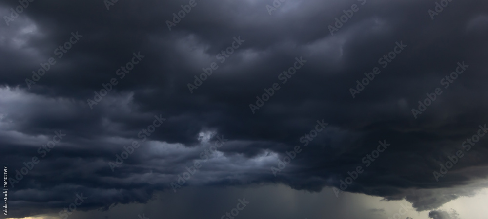 Poster the dark sky with heavy clouds converging and a violent storm before the rain.bad or moody weather s