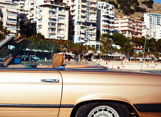real old fashion cabriolet car at seaside touristic view lifestyle