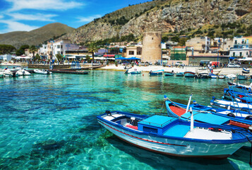 Palermo, Sicily - July 29, 2016: Small port with fishing boats in the center of Mondello