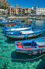 Palermo, Sicily - July 29, 2016: Small port with fishing boats in the center of Mondello