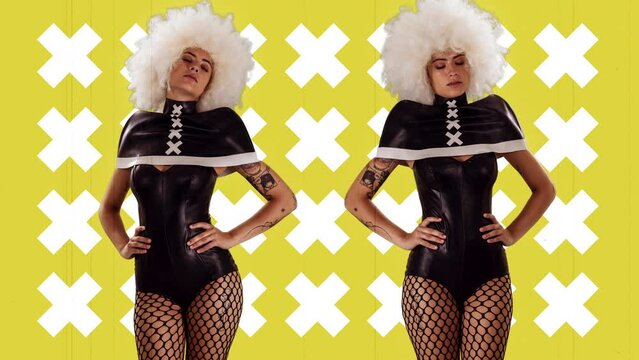 Female dancer posing against yellow background