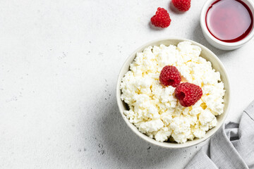 Keto diet, cottage cheese with raspberry jam and fresh berries. Top view, flat lay, copy space.