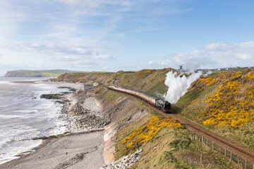 SR West Country No. 34046 'Braunton' works along the Cumbrian coastline at Nethertown with 1Z16 15:30 Carlisle to Rugby 'The Lakelander' on Saturday 9th April 2022. 