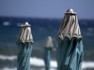 summer sun umbrellas on liguria beach