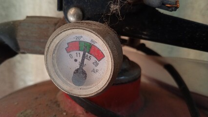 Close up photo of fire extinguisher regulator which is still normal pressure