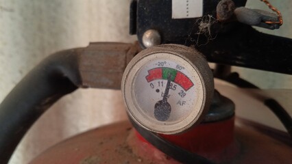 Close up photo of fire extinguisher regulator which is still normal pressure