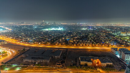 Fototapeta na wymiar Aerial view to villas and houses from JLT district night timelapse.