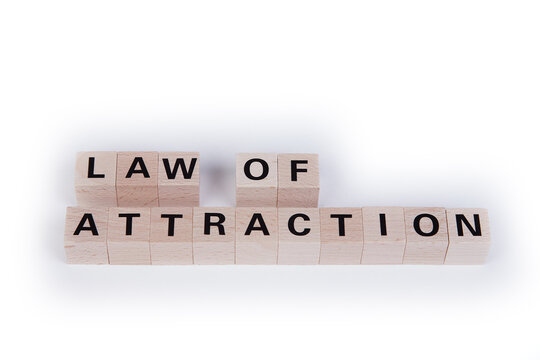 wooden cubes showing the words law of attraction