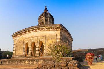 Fototapeta premium Famous terracotta (fired clay of a brownish-red colour, used as ornamental building material) artworks at Lalji Temple, Bishnupur, West Bengal, India. It is popular UNESCO heritage site of India.