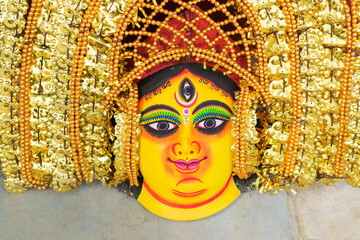 Colorful Chhau (or chhou) masks of Goddess Durga, handicrafts on display for sale - at Charida,...