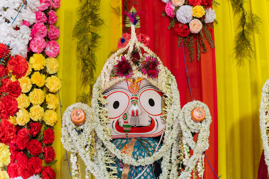 Idols of God Balaram. Lord Balaram , brother of Lord Jagannath is being worshipped with garlands for Rath jatra festival - at Howrah, West Bengal, India.