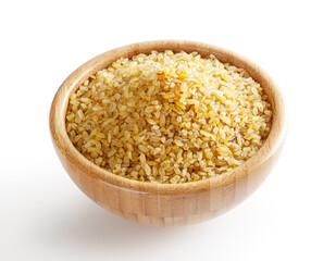 Uncooked dry bulgur in wooden bowl isolated on white background with clipping path