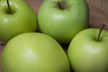 Renet simirenko green apples, top view, close-up. Macro shot of fruit.