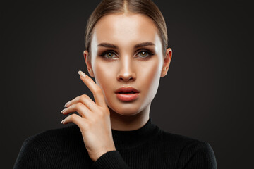 Fototapeta na wymiar Portrait of attractive girl with healthy clean skin and beautiful make-up. Aesthetic cosmetology and makeup concept.