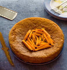Delicious Vegan Mango Cake isolated on light blue background.Homemade,moist, fresh, summer fruit cake  topped with mango slices. Top view.