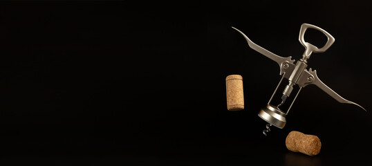 Corkscrew and corks on the black background.
