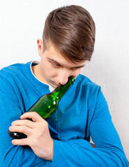 Sad Young Man with a Beer