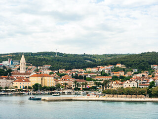 Fototapeta na wymiar Waterfront view of marina and town in Supetar, Brac Island Croatia