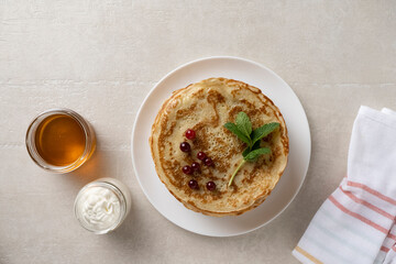 Big pancakes on the table, cooking delicious homemade pancakes
