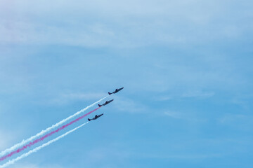 Group of fighters creating tricolore on the sky