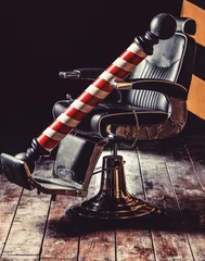Fotobehang Logo of the barbershop, symbol. Stylish vintage barber chair. Hairstylist in barbershop interior. Barber shop chair. Barbershop armchair, salon, barber shop for men. Barber shop pole © Yevhen