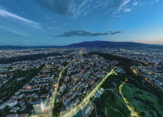 Night view of Sofia and Vitosha. Lozenetz with lights. Dusk with clouds.