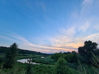 fantastic sunsets over the hills, meadows and forest