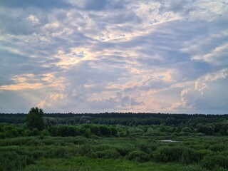 fantastic sunsets over the hills, meadows and forest