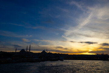 Istanbul silhouette at sunset from a ferry. Cityscape of Istanbul