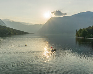 Beautiful forest reflection in the Bohinj lake with surrounding mountains