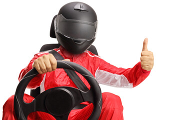 Race with a helmet in a car seat making a thumb up sign